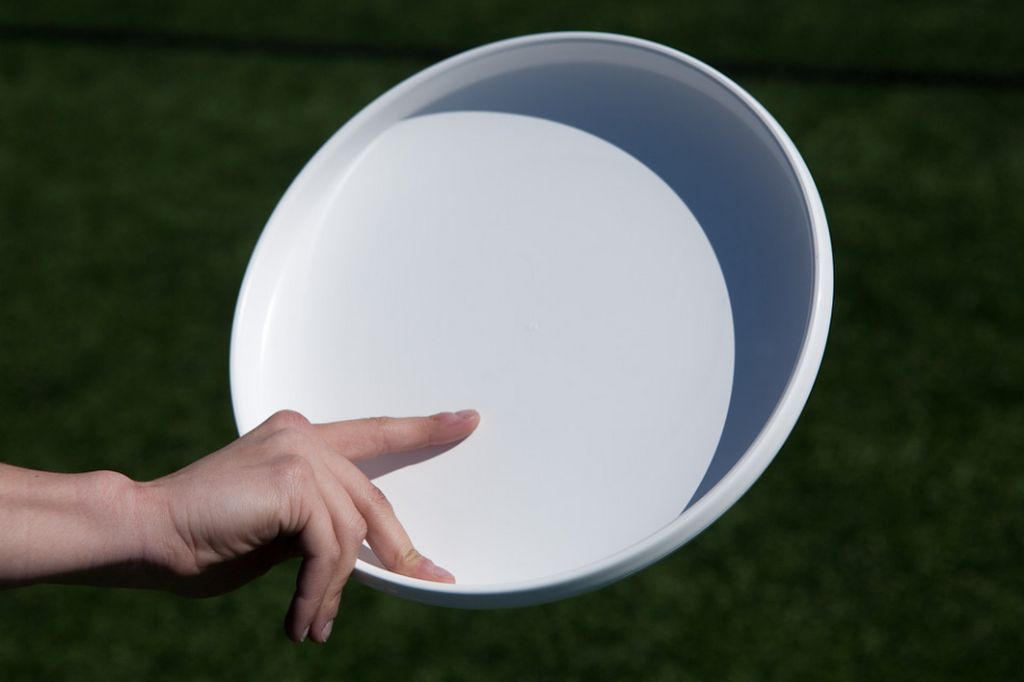 the forehand throw involves gripping the disc with your fingers underneath and releasing off your index finger.
